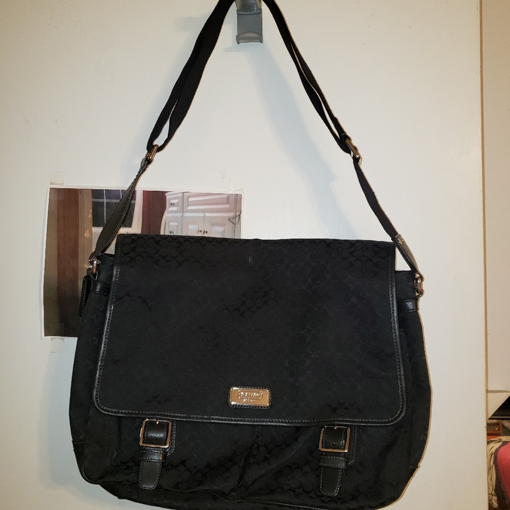 Black Coach signature canvas jacquard messenger bag.